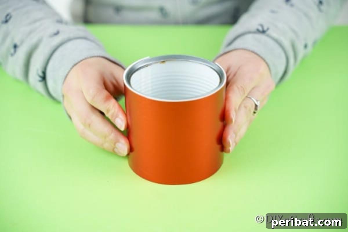 Red foam paper securely wrapped around the tin can