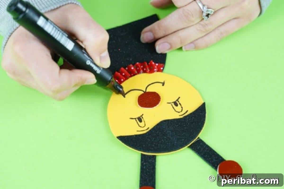 Drawing the ladybug's face with eyes and a smile