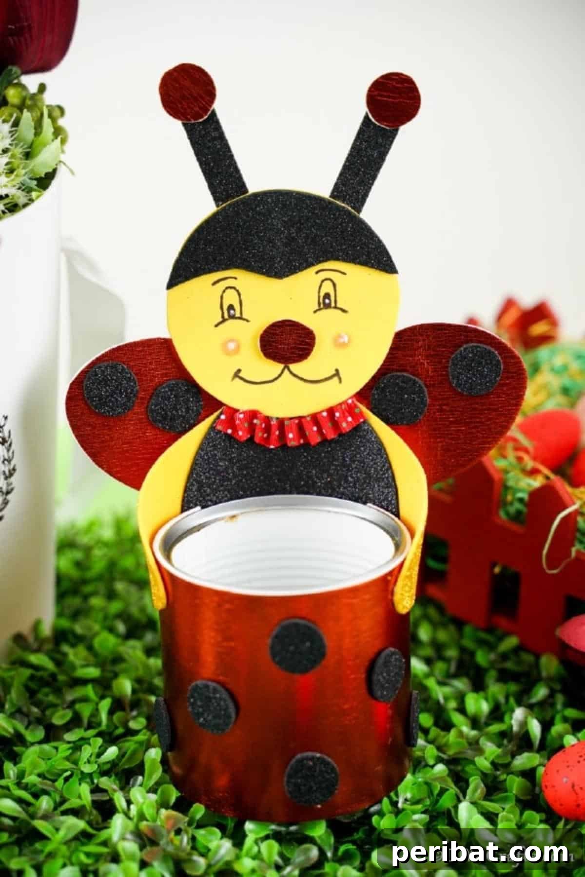 Cute Upcycled Tin Can Ladybug Organizer on Fake Grass