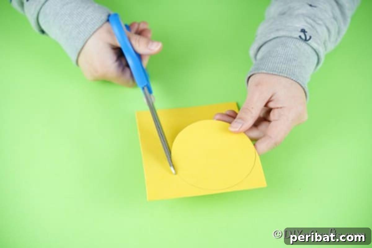 Cutting out the yellow foam paper circle