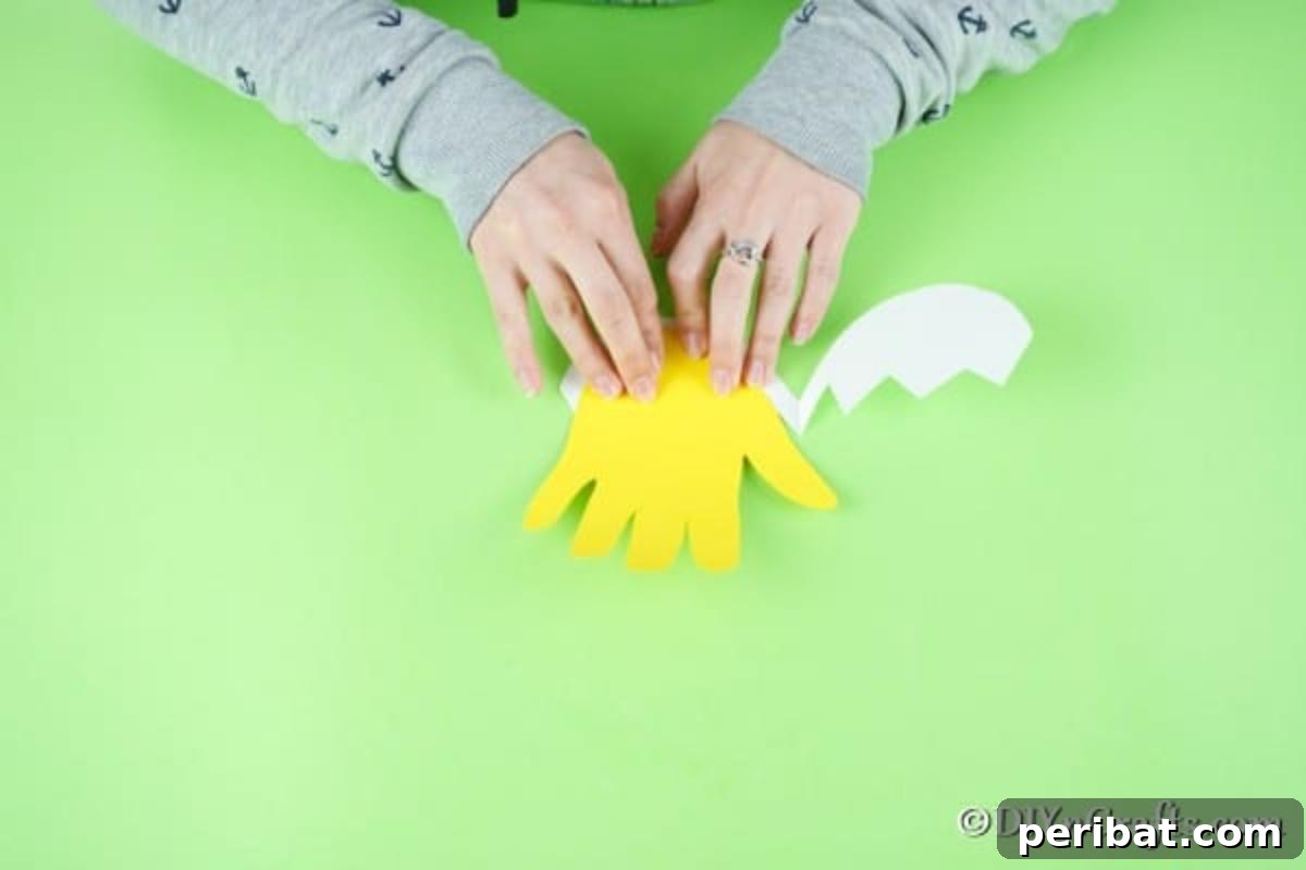 Gluing egg onto hand