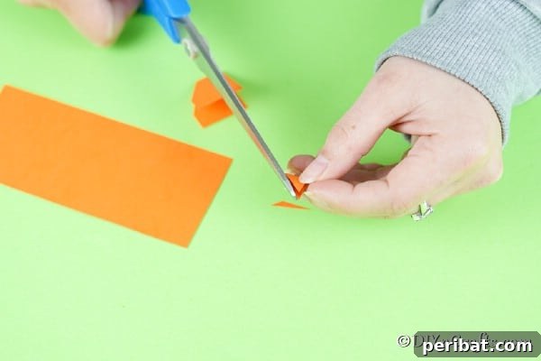 Simple Repurposed Bucket Spring Chicken 24 Cutting beak from orange paper