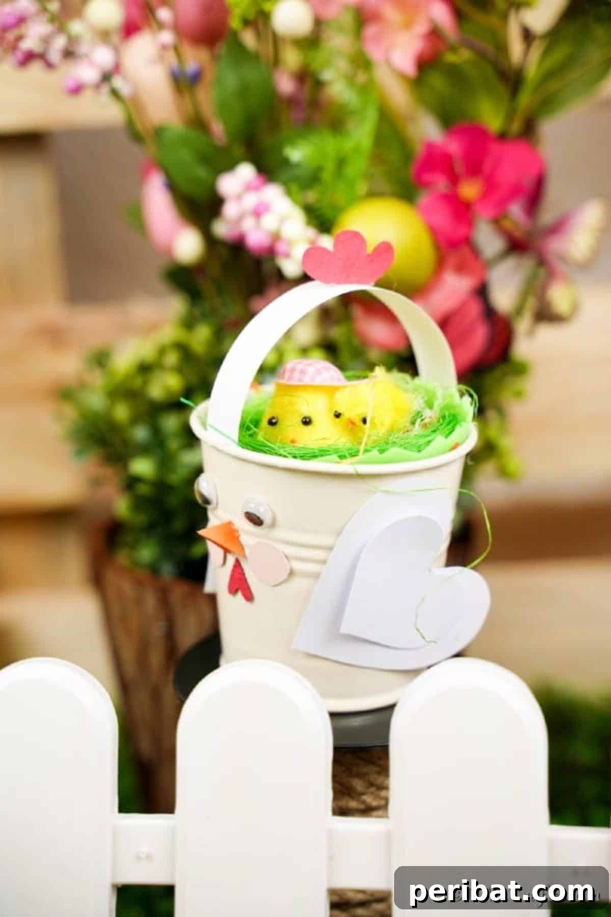 Simple Repurposed Bucket Spring Chicken 5 Finished chicken bucket craft placed by a white picket fence, adding spring charm