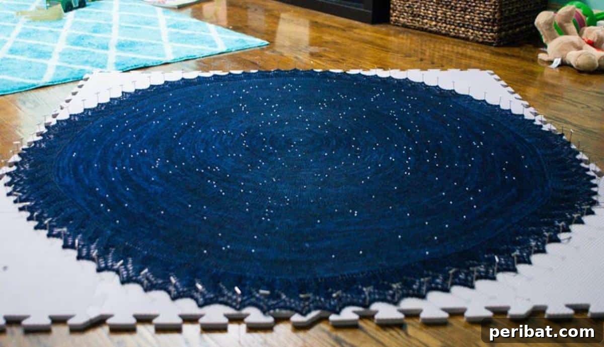 Crafting Constellations: A DIY Celestial Shawl 4 Detailed shot of the knitted star map, showcasing the crystal beads used for constellations