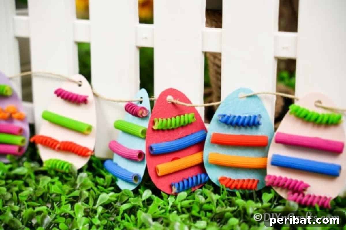 Whimsical Pasta Easter Egg Garland 5 A charming pasta egg garland displayed against a rustic white picket fence