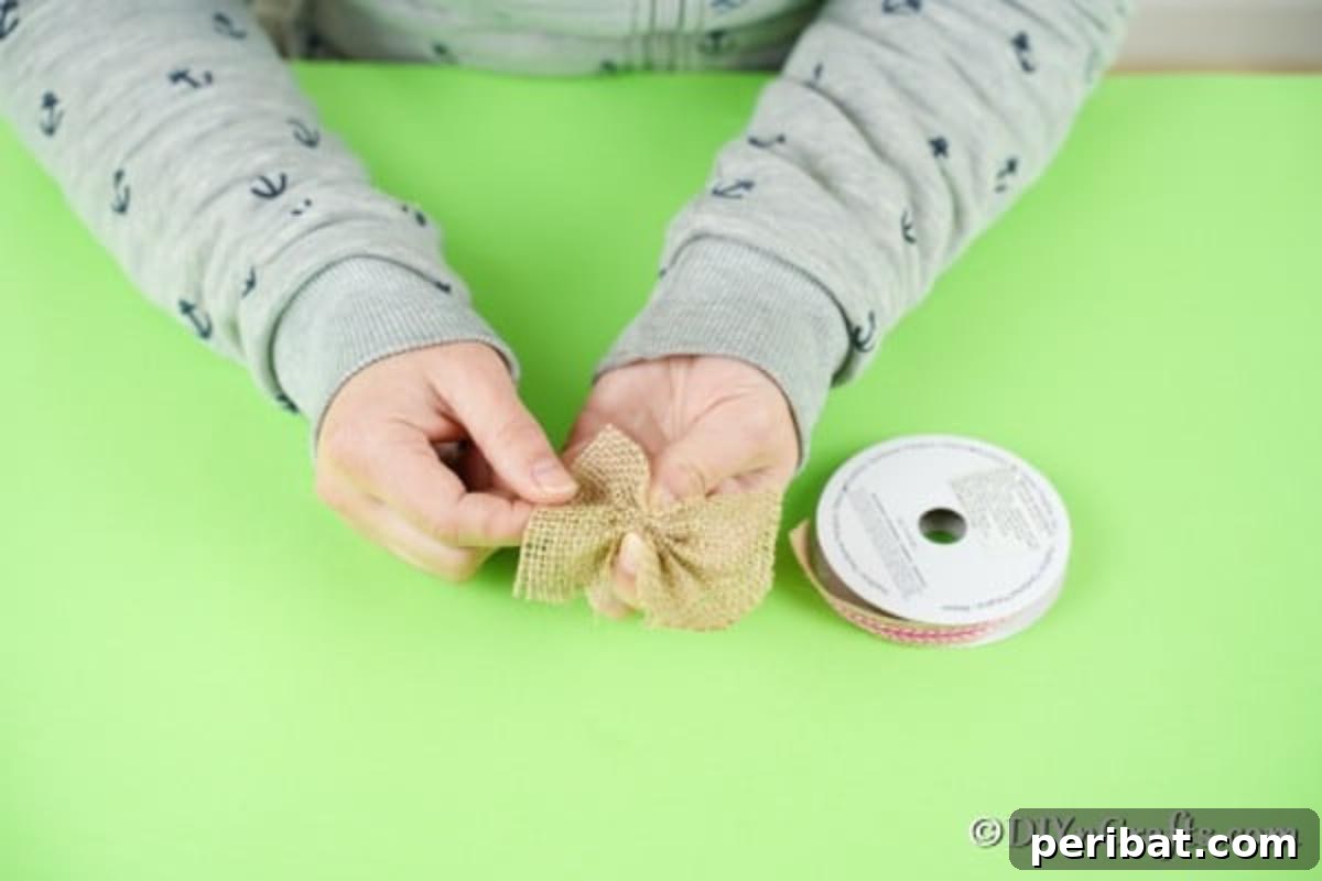 Adorable Upcycled Spoon Bunnies for Easter 11 Creating a rustic burlap bow for the bunny craft