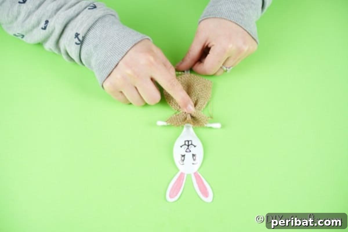 Adorable Upcycled Spoon Bunnies for Easter 14 Attaching the burlap dress and Q-tip for the girl bunny design