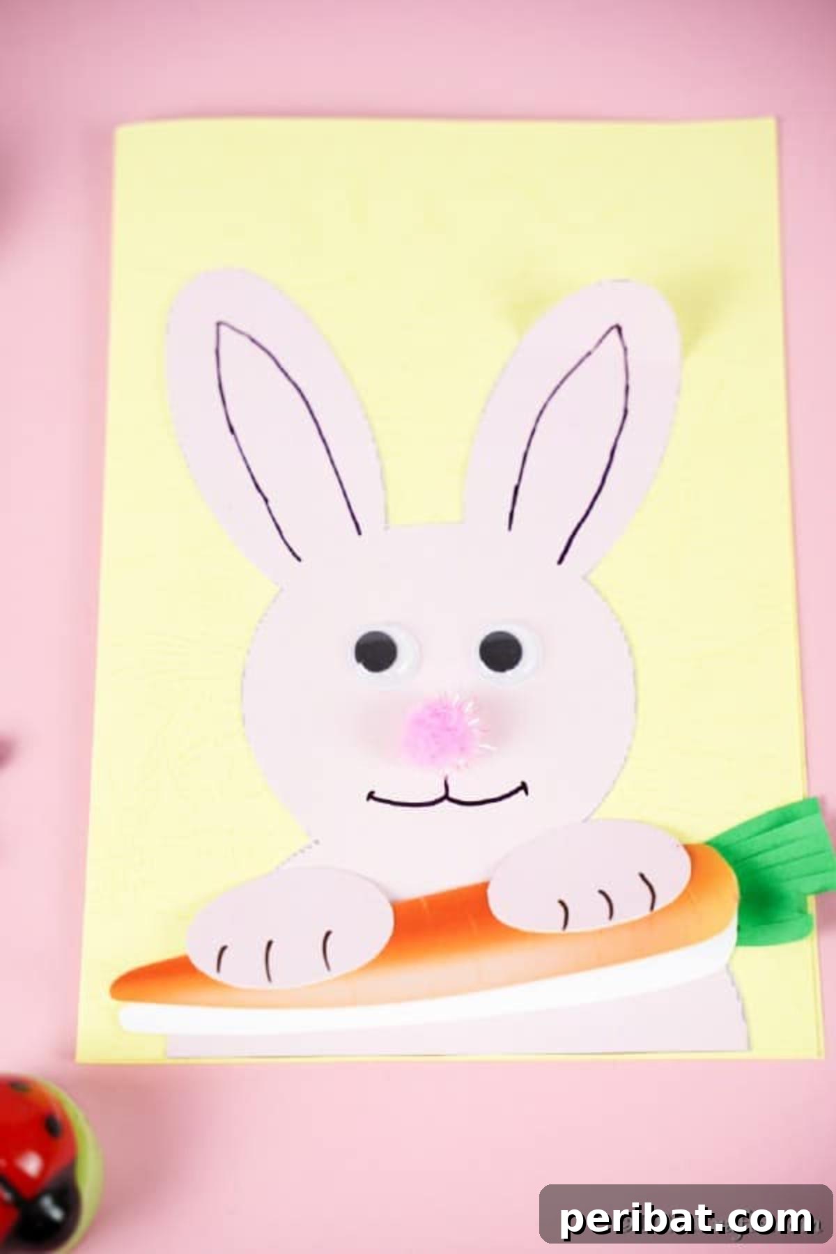 DIY Easter Bunny Card Free Printable Video 3 Printed Easter bunny card on pink surface