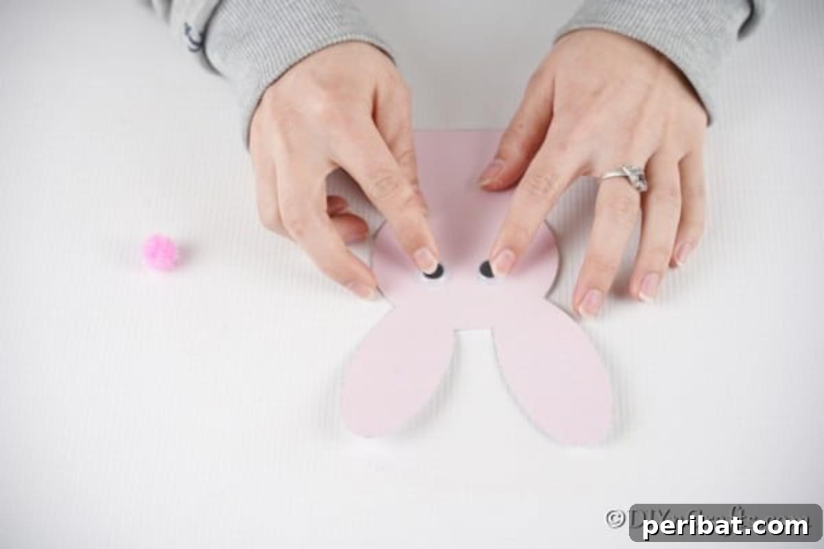 DIY Easter Bunny Card Free Printable Video 8 Adding googly eyes to bunny