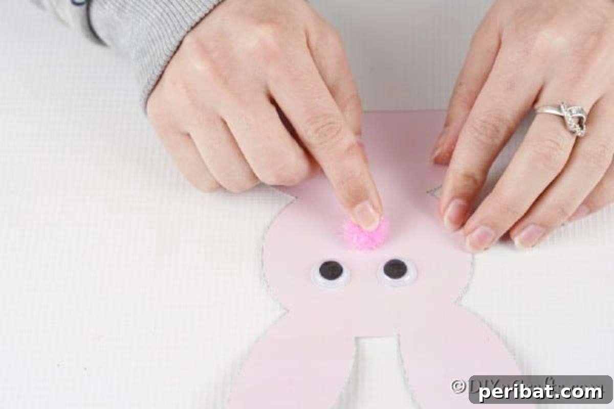 DIY Easter Bunny Card Free Printable Video 9 Adding pom pom nose to easter bunny card