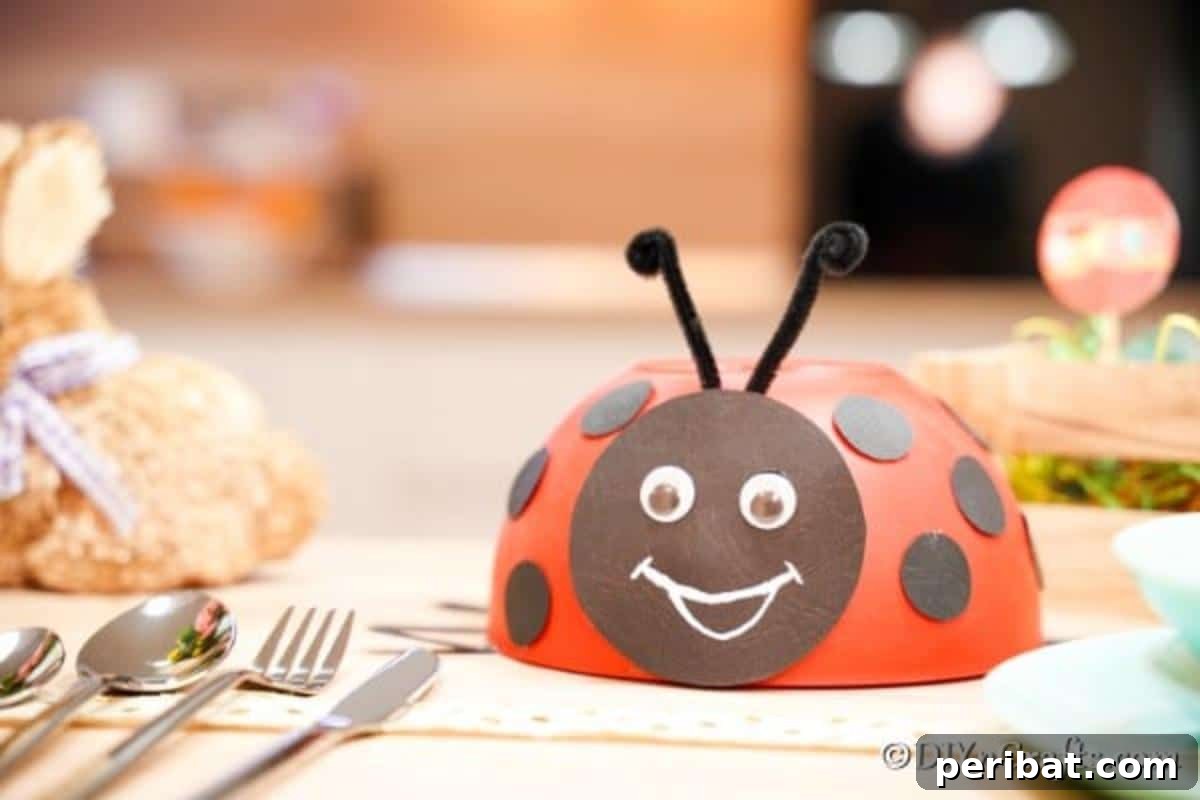 Repurposed Ladybug Bowl Art 15 The finished upcycled bowl ladybug decoration displayed on a table amidst other decorative elements, ready for a party.