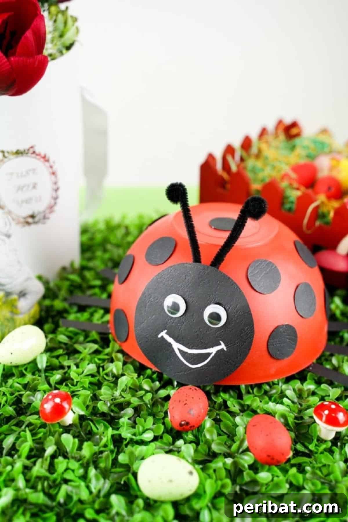 Repurposed Ladybug Bowl Art 4 A collection of upcycled bowl ladybugs and other faux insects displayed on grass, showcasing creative variations in a garden setting.