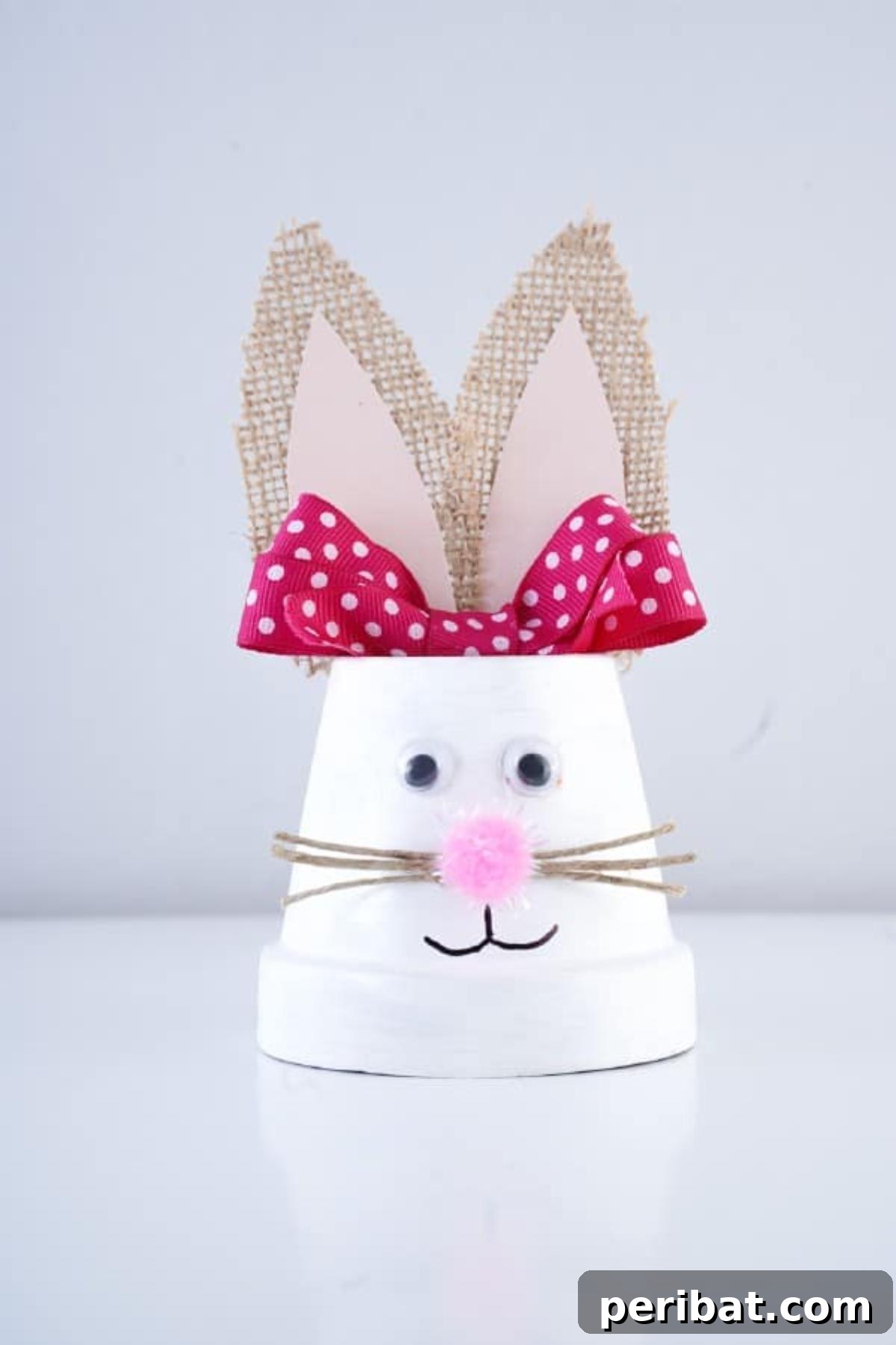 Charming Repurposed Planter Bunnies for Easter 3 Close-up of a finished Easter bunny flower pot decoration with a rustic feel.