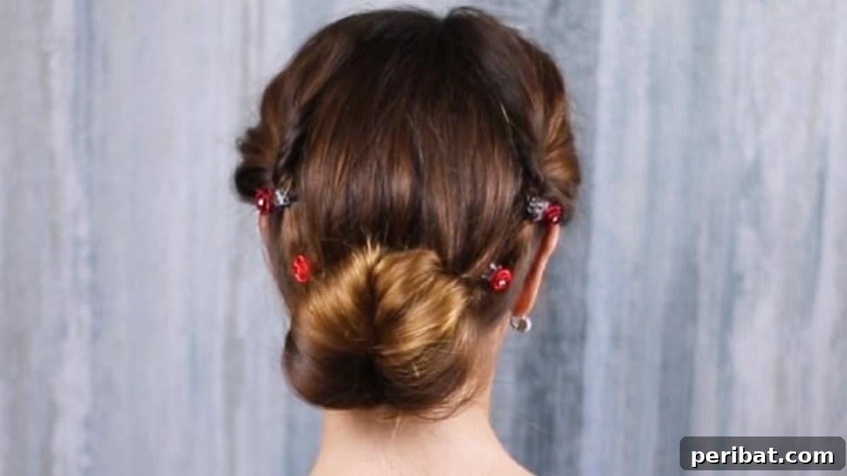 Rose-Kissed Low Bun Updo 4 A rear view of a brunette woman proudly displaying her beautifully crafted low bun updo hairstyle.