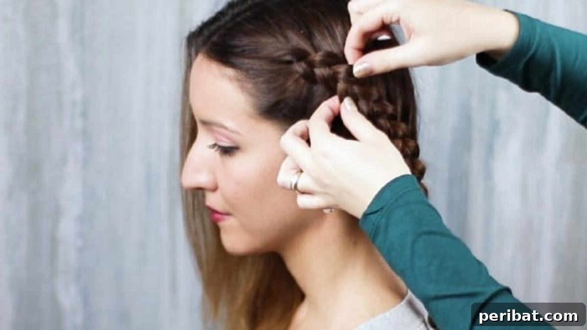 Gorgeous Double Dutch Braids: Step-by-Step Video Guide 11 Technique of gently loosening a French braid to add volume and create a fuller look