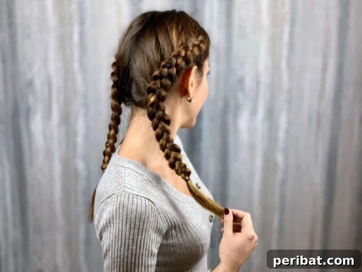 Gorgeous Double Dutch Braids: Step-by-Step Video Guide 3 Brunette model with grey shirt confidently showcasing perfectly styled double Dutch braids