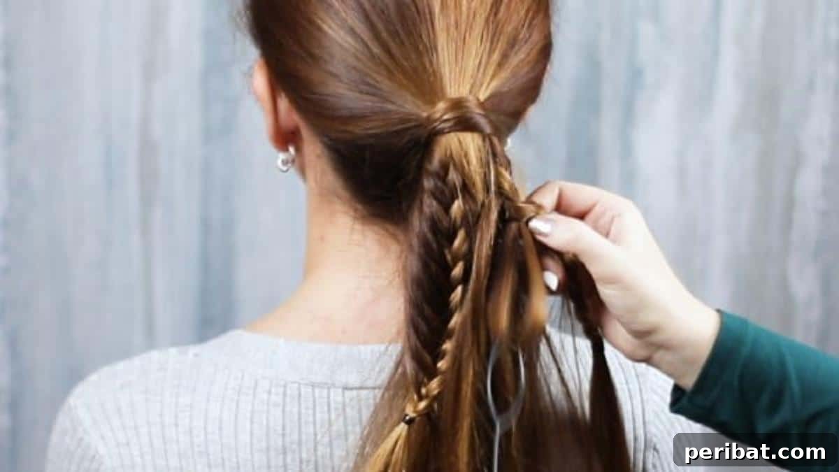 The braiding process with the Topsy Tail in action, showing hair being woven