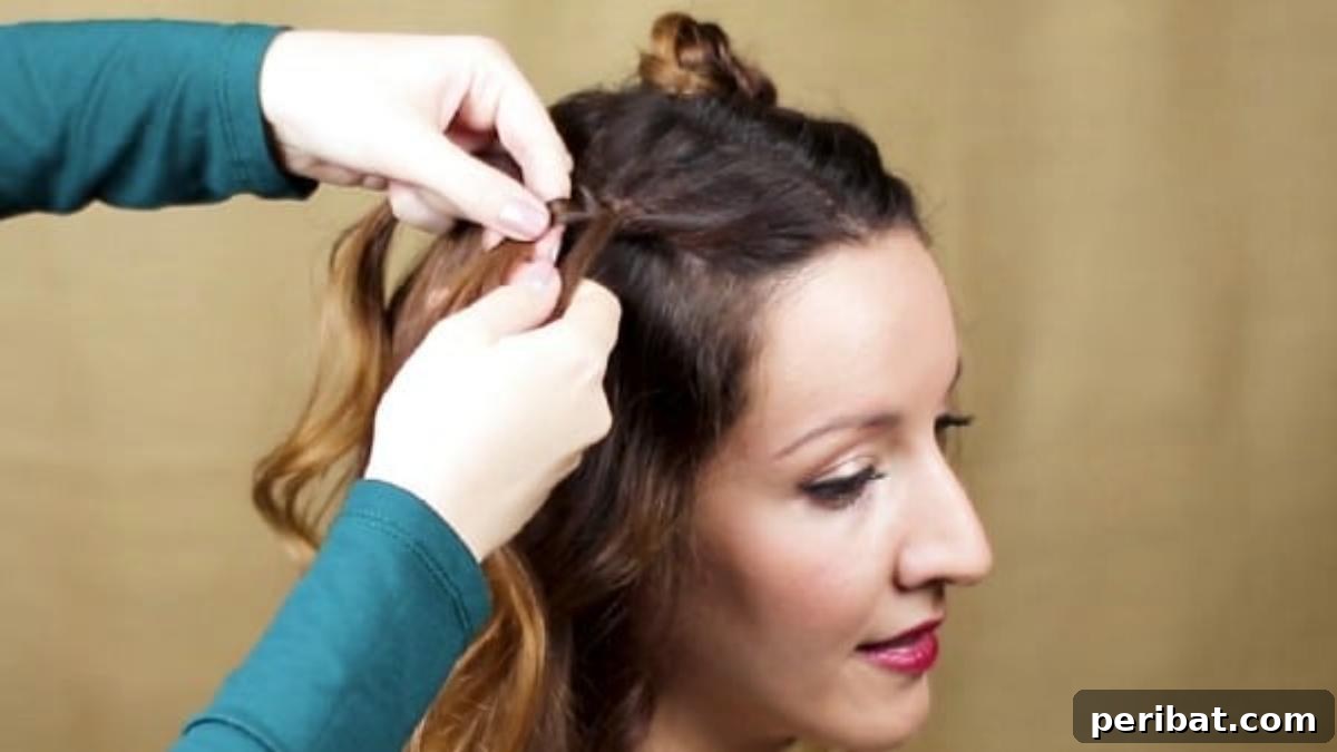 Chic Braided Twin Bun Half Updo 12 Braiding the second side of hair to match the first