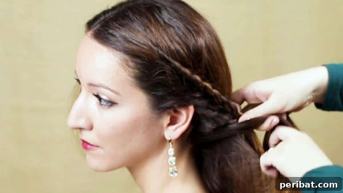 Elegant Side Braid Ponytail Tutorial for a Polished Look 9 Bringing braid around the back of head
