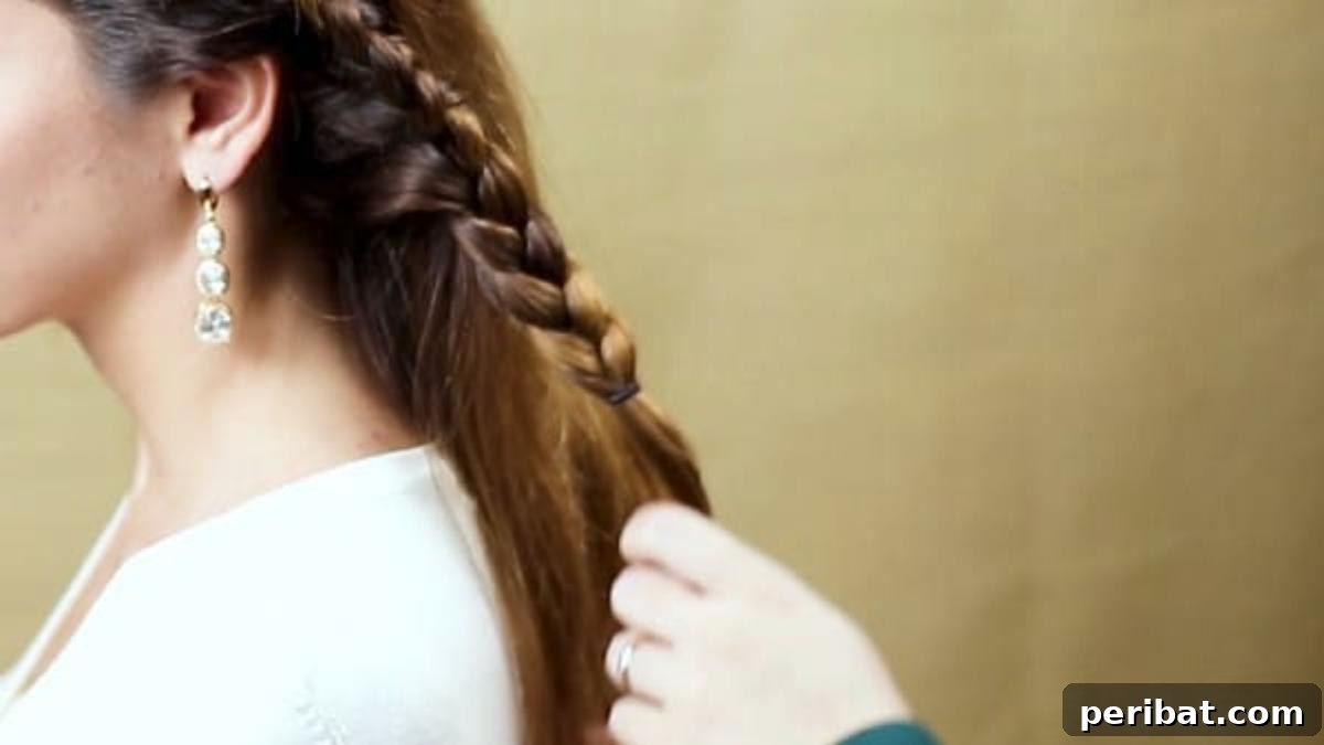 Elegant Side Braid Ponytail Tutorial for a Polished Look 10 Braiding down length of hair