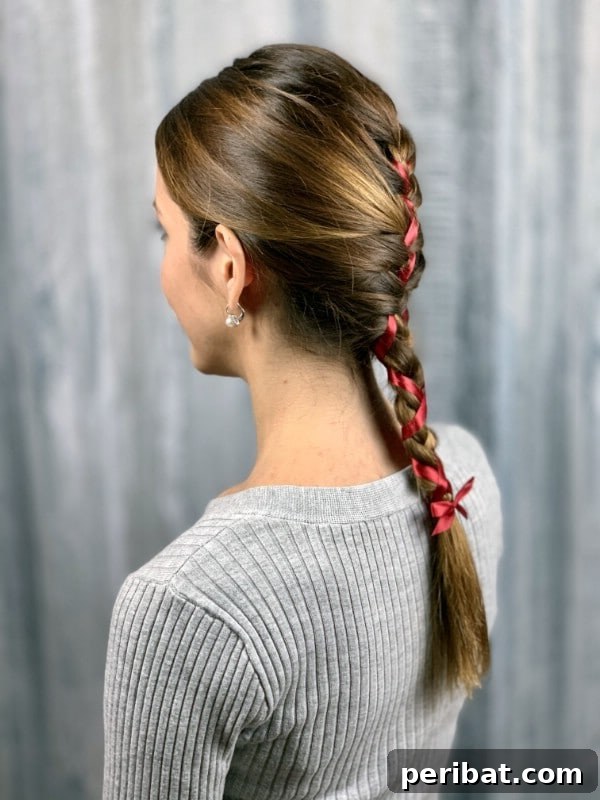 Sweet Ribbon Braid Style 3 A side view of a simple, elegant braid with a subtle ribbon woven into it, showcasing the added dimension and style.