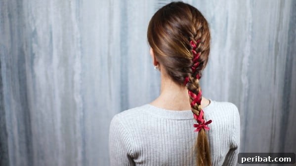 Sweet Ribbon Braid Style 5 Close-up of a beautifully braided hairstyle with a ribbon intricately woven, showing texture and detail.