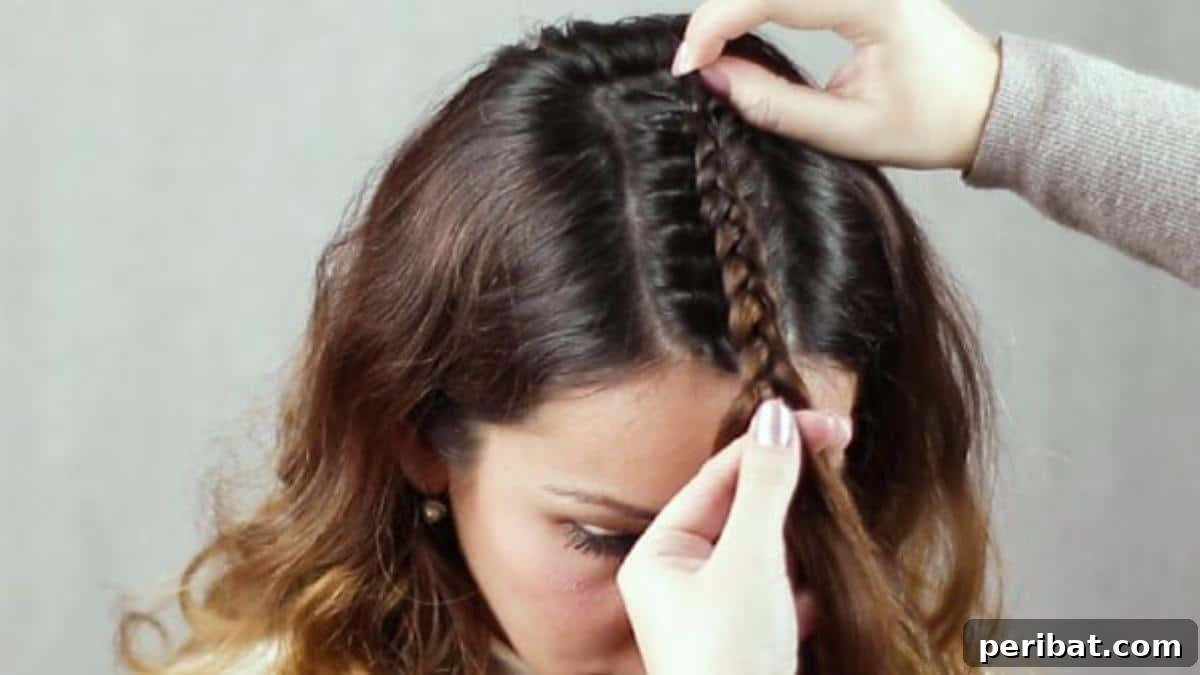 Regal Braided Crown Updo Video Steps 7 Step 2: The completed initial braid reaching the forehead.