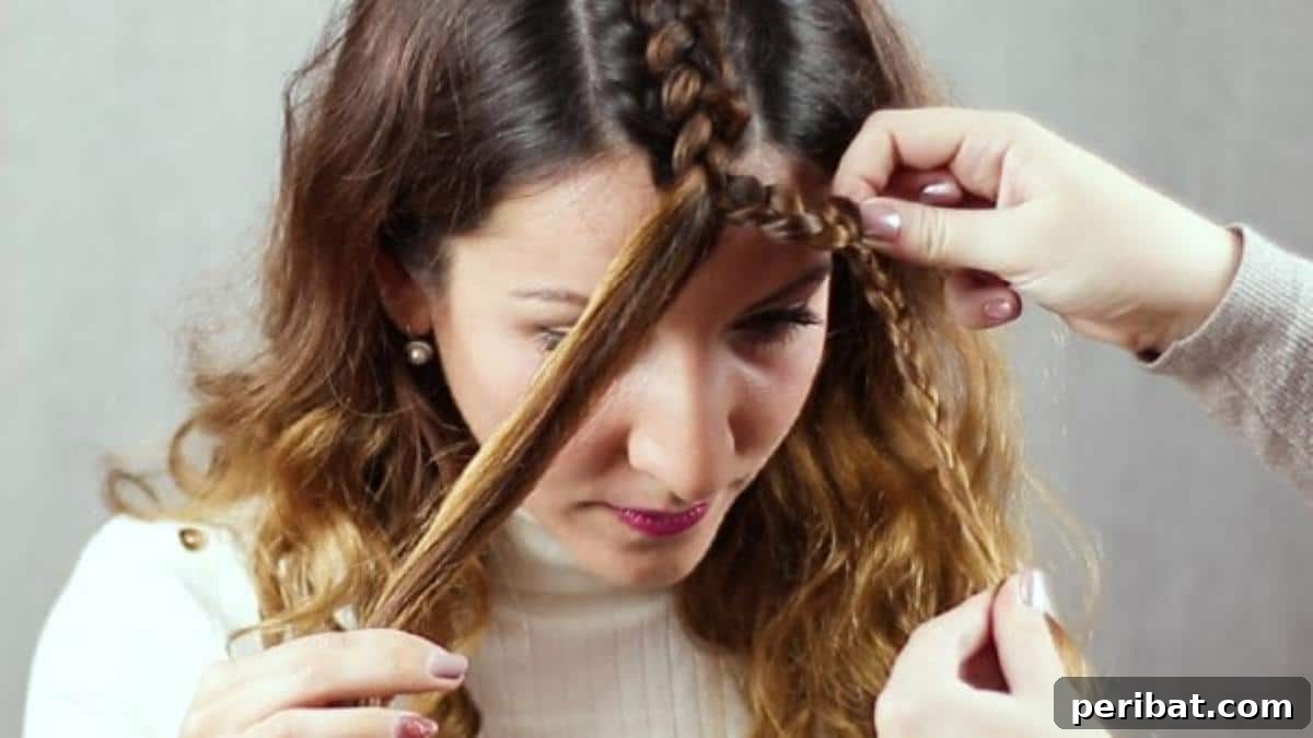 Regal Braided Crown Updo Video Steps 9 Step 3: Braiding one side section of hair to form part of the crown.
