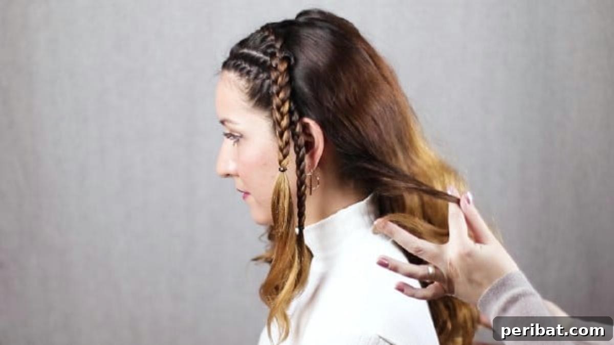 Quick Side Braided Half Up Tutorial 16 Gathering hair sections to merge the braids