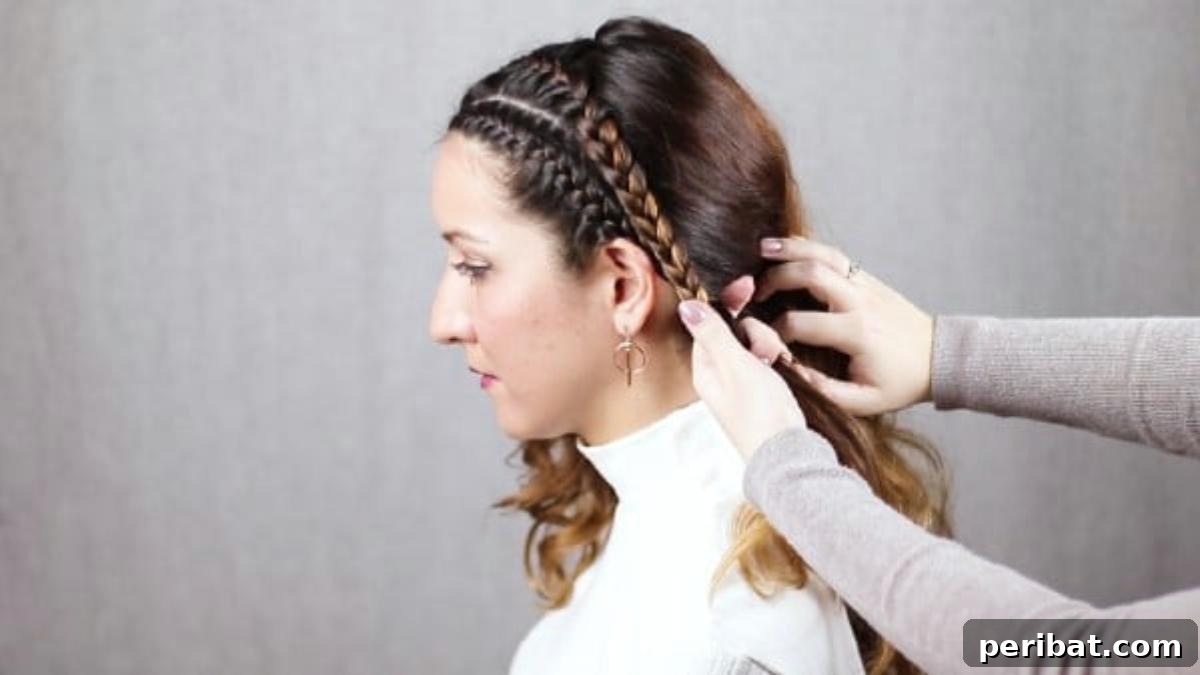 Quick Side Braided Half Up Tutorial 17 Securing the merged braids with a hair tie