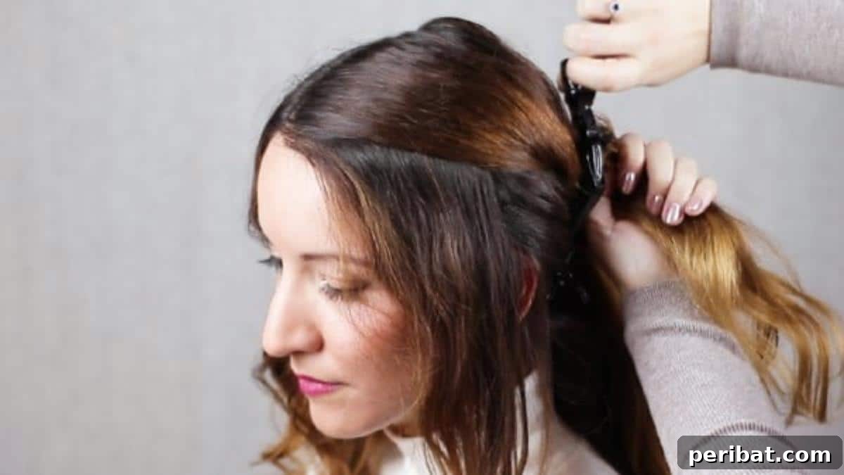 Quick Side Braided Half Up Tutorial 7 Combing and meticulously sectioning front hair for braids