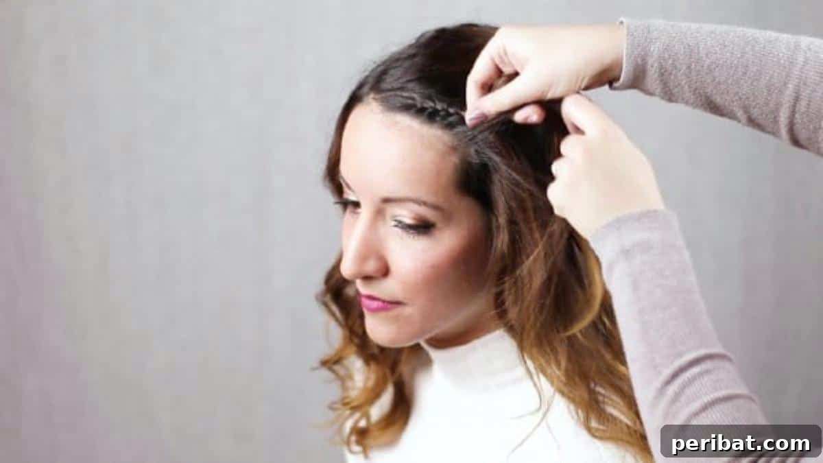 Quick Side Braided Half Up Tutorial 9 Completing the initial French braid along the hairline