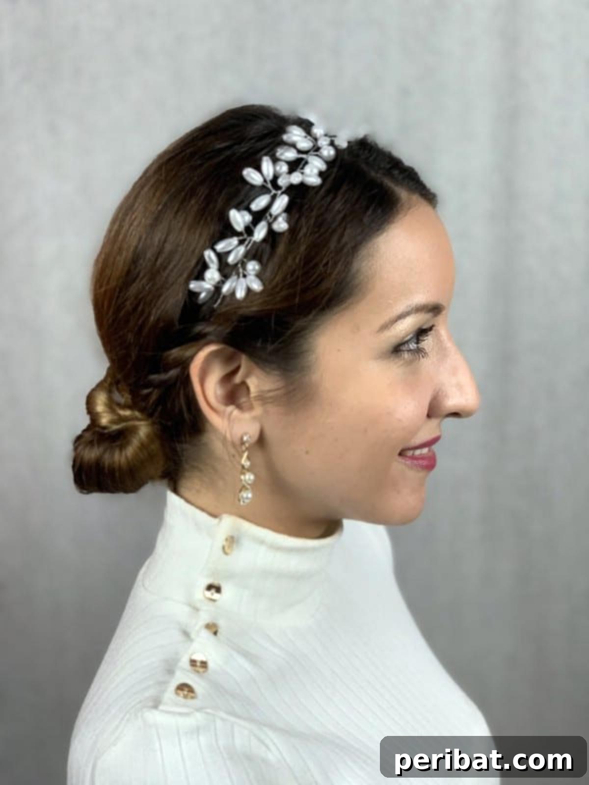 Chic Low Braided Updo Tutorial 17 Side profile of the beautifully styled low braided bun, showcasing its intricate details and elegant shape