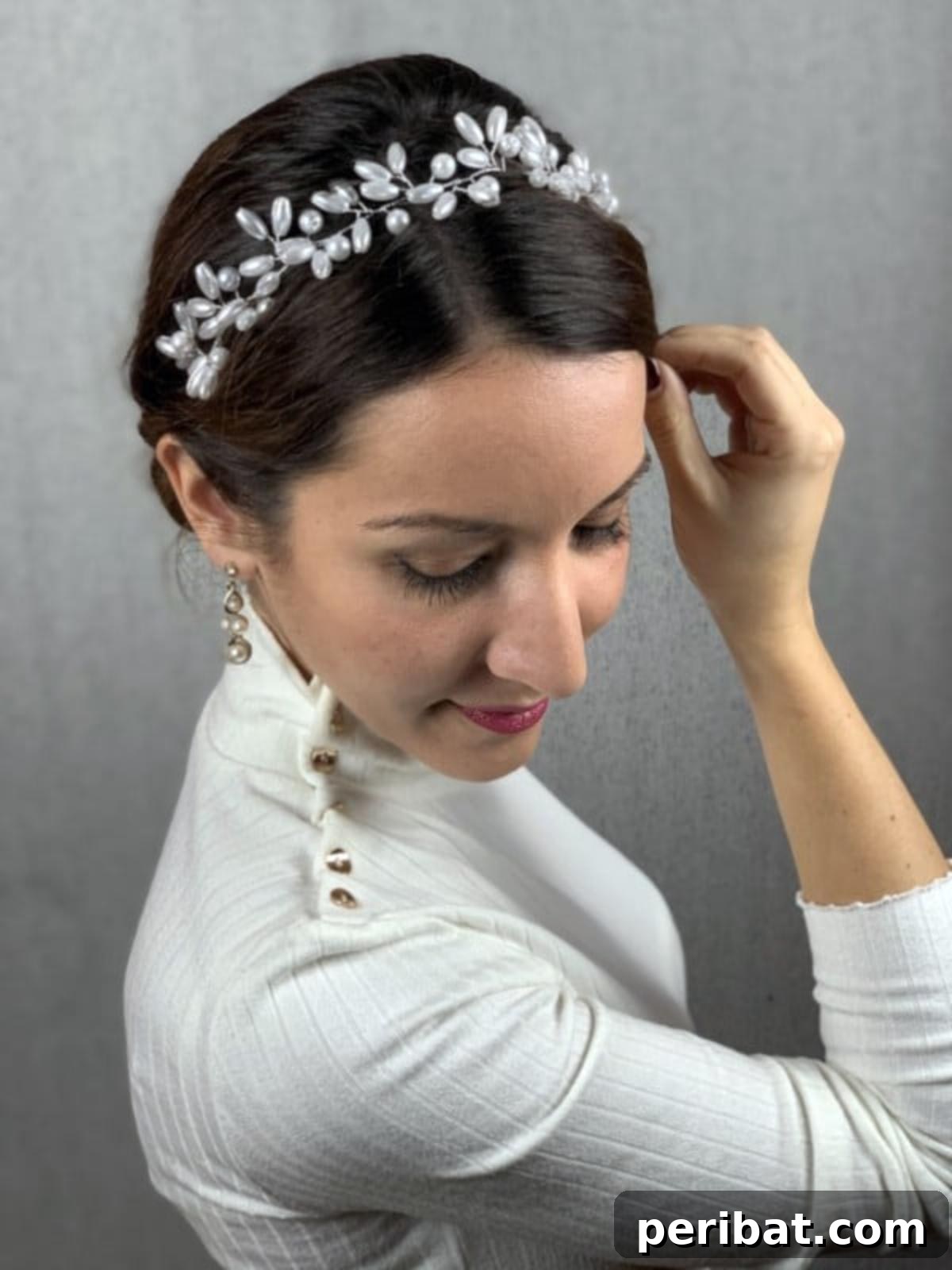 Chic Low Braided Updo Tutorial 3 Brunette hair styled in a low braided bun, accented with a delicate beaded headband