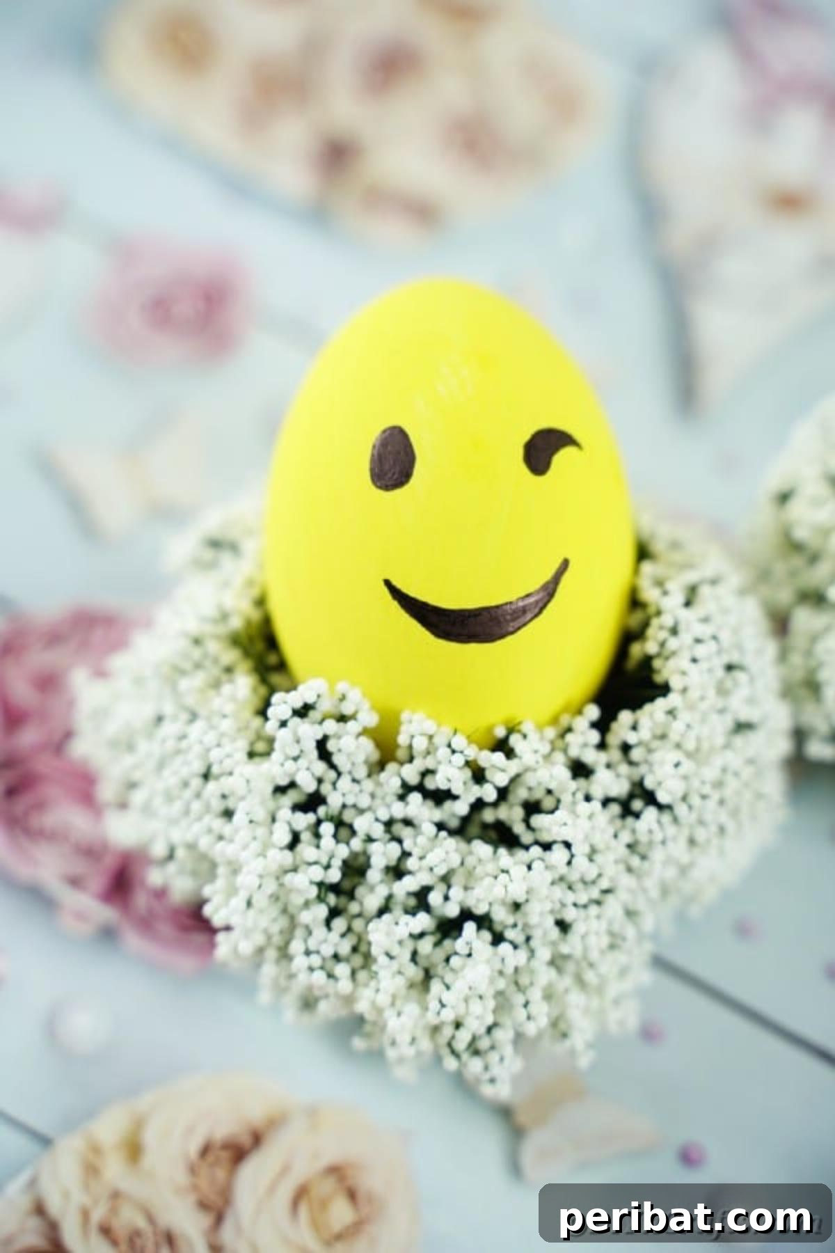 Crafting Cheerful Emoji Easter Eggs 12 Winking emoji egg on babies breath