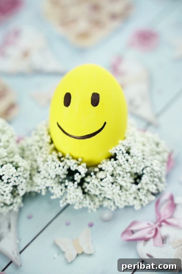Crafting Cheerful Emoji Easter Eggs 19 Smiling emoji Easter egg on babies breath wreath