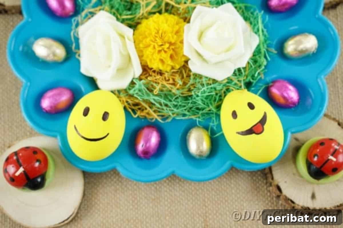 Crafting Cheerful Emoji Easter Eggs 3 Emoji Easter eggs on blue egg tray