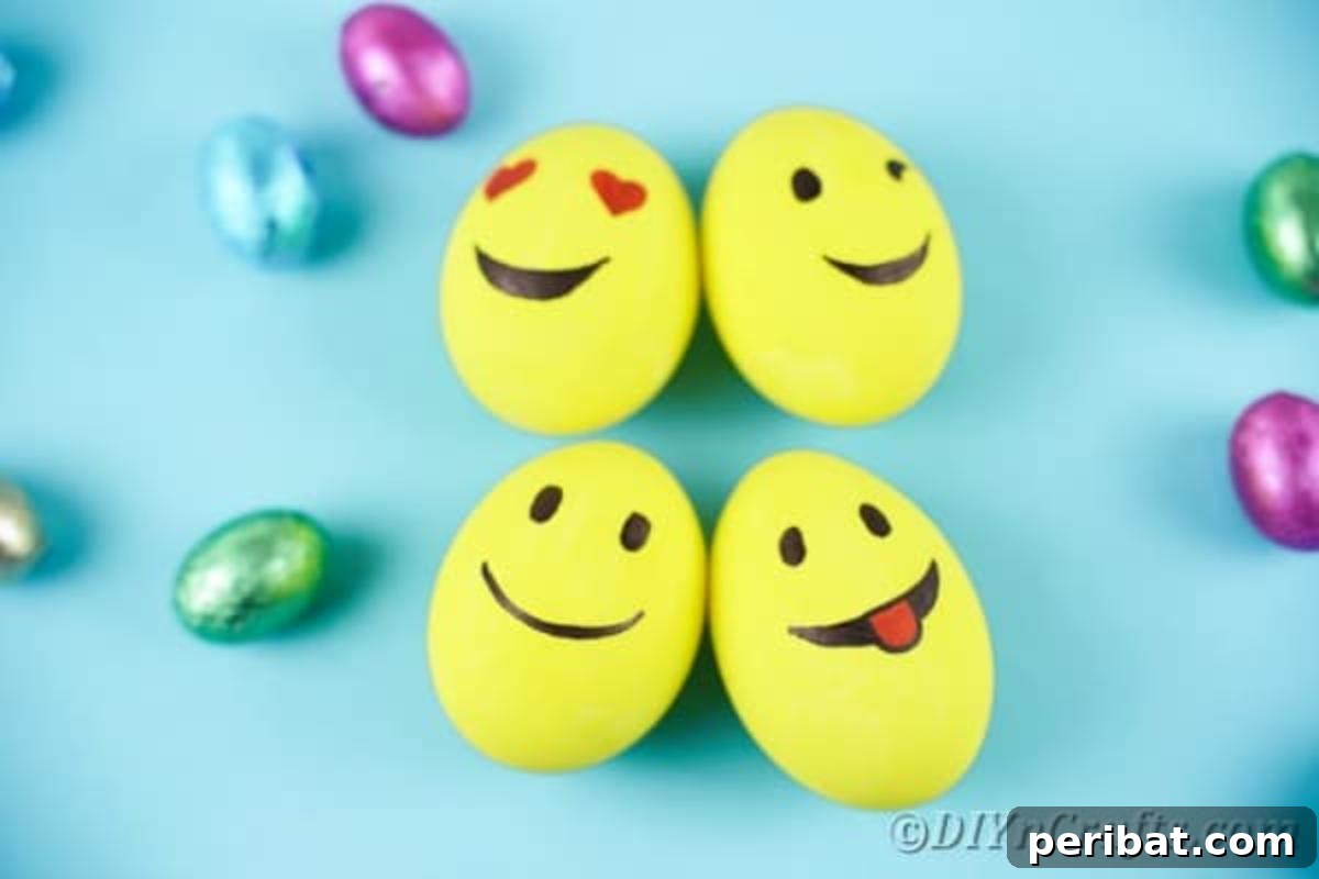 Crafting Cheerful Emoji Easter Eggs 5 Emoji eggs on blue surface
