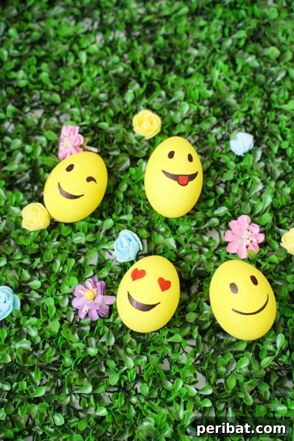 Crafting Cheerful Emoji Easter Eggs 6 Yellow eggs on grass with flowers
