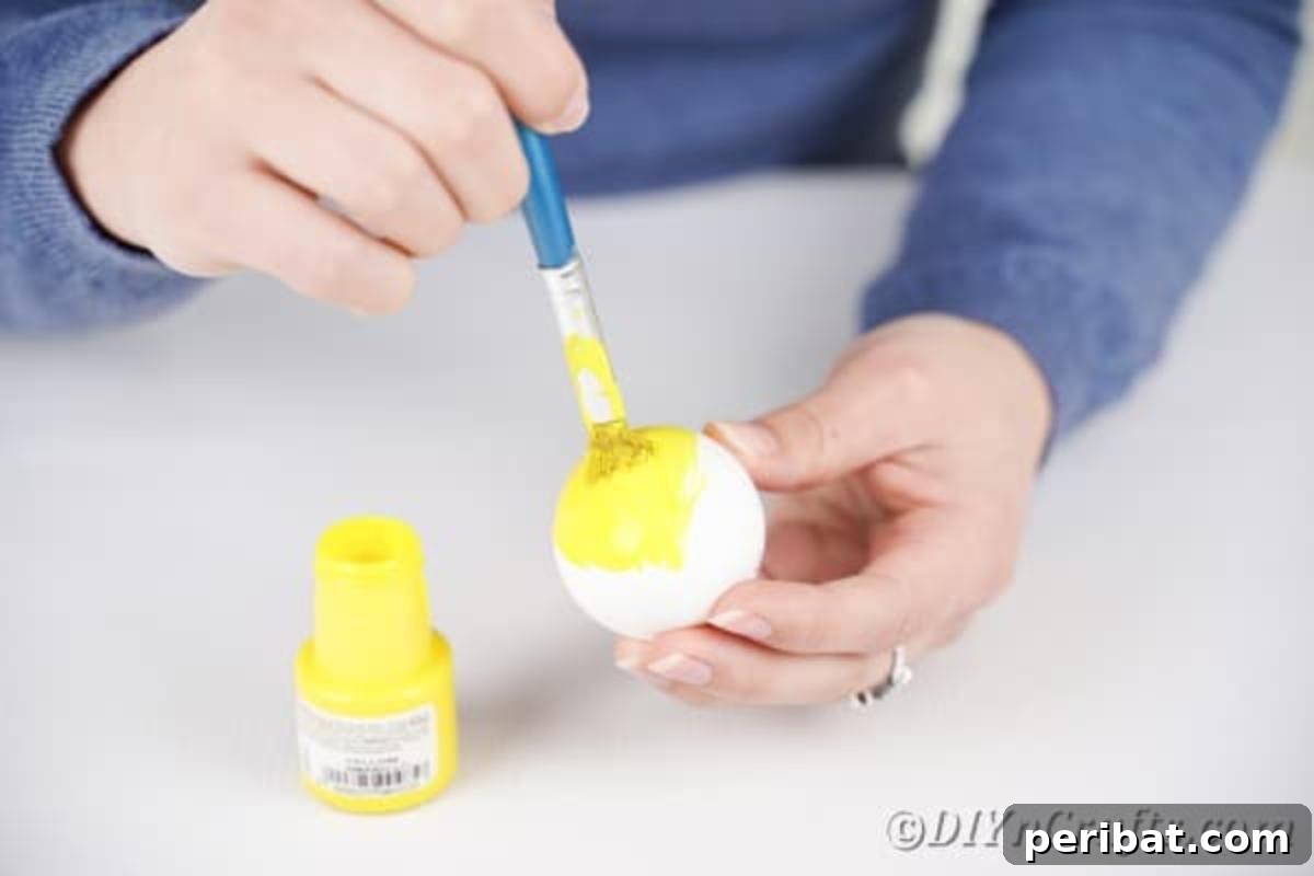 Crafting Cheerful Emoji Easter Eggs 9 Painting eggs yellow
