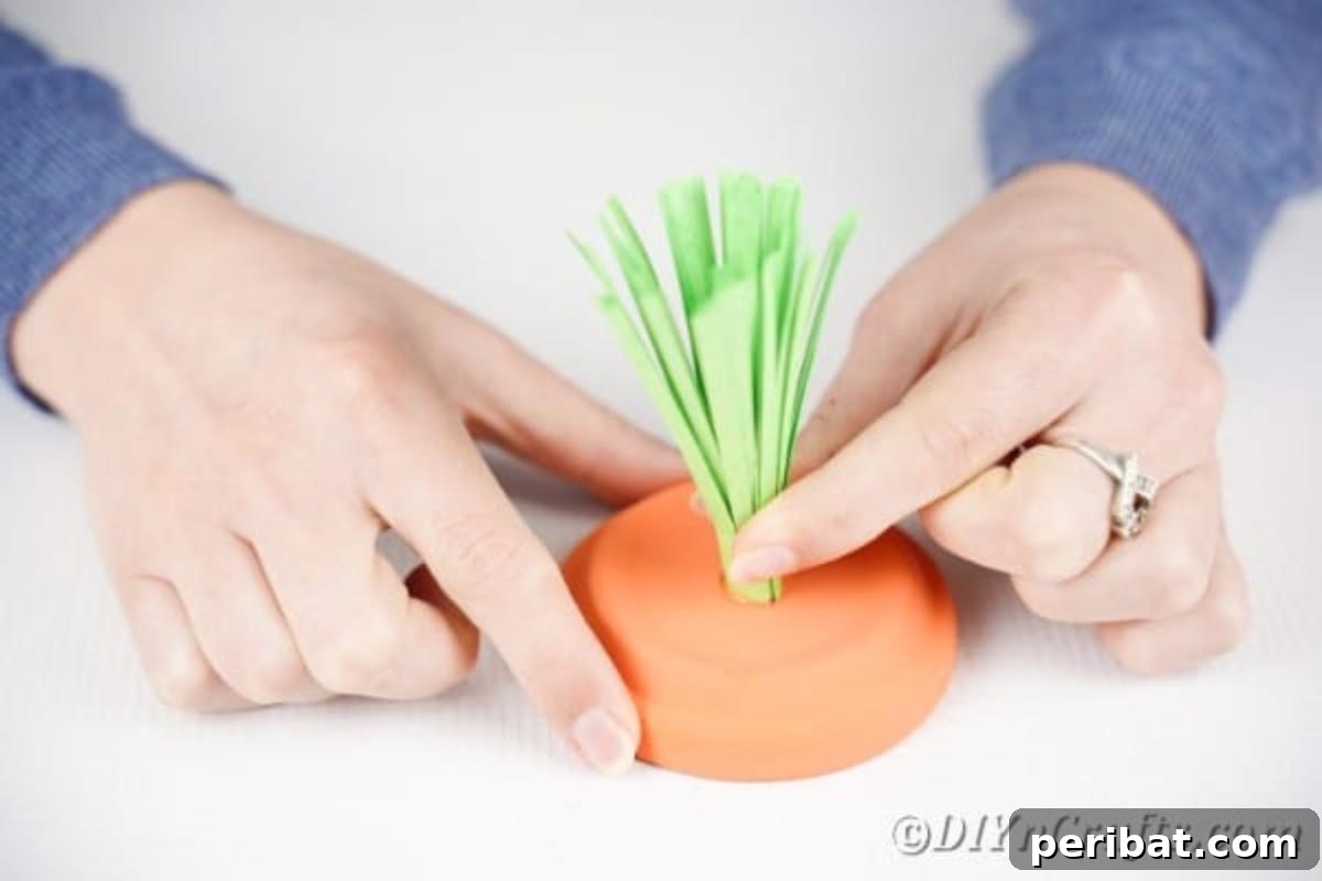 Handcrafted Easter Carrot Pots 11 Gluing paper stem to top of flower pot