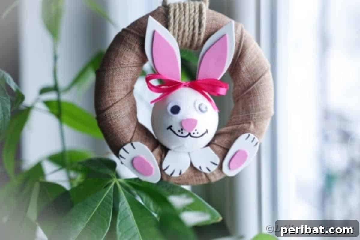 DIY Adorable Easter Bunny Wreath Video Guide 3 Close-up of a rustic Easter bunny wreath hanging on a wall next to green foliage, highlighting the burlap texture.