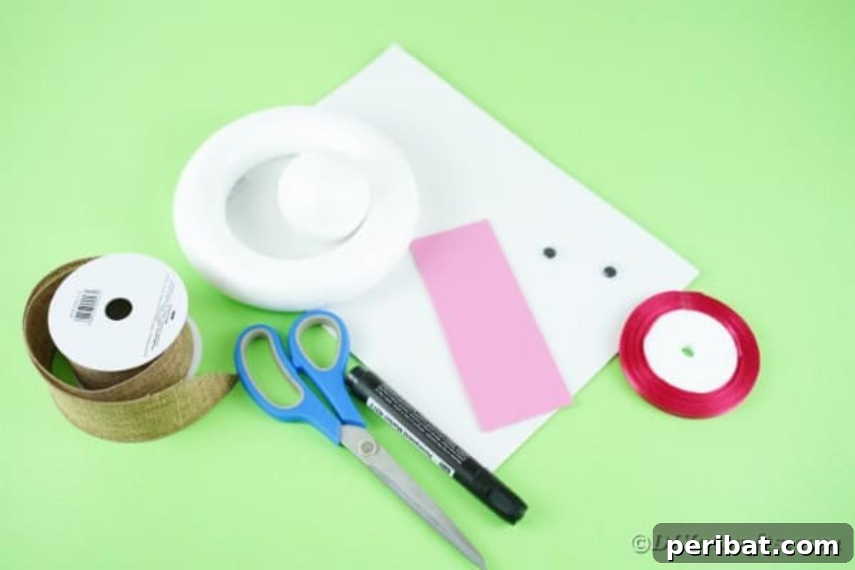 DIY Adorable Easter Bunny Wreath Video Guide 6 Assortment of craft supplies laid out, including a wreath form, styrofoam ball, burlap ribbon, paper, googly eyes, and glue.
