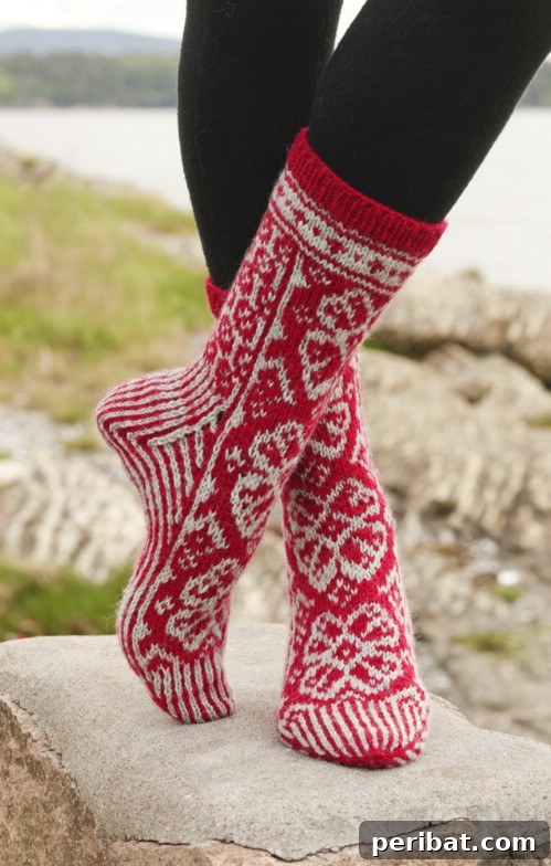 Festive Knitted Socks Featuring Reindeer and Snowflakes