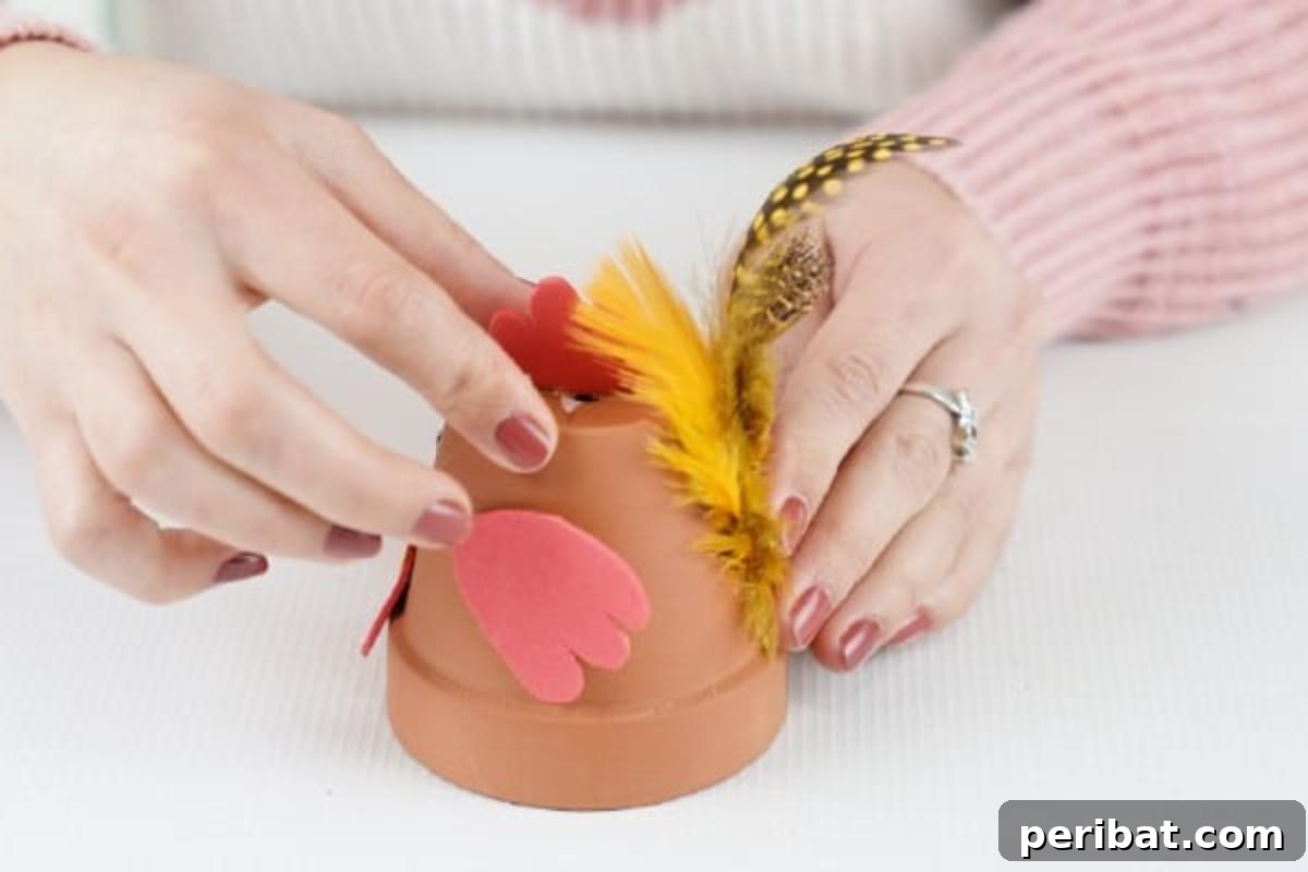 Craft Your Own Cute Flower Pot Chicken 15 Adding feathers to flower pot chicken