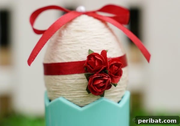 Yarn egg in blue cup