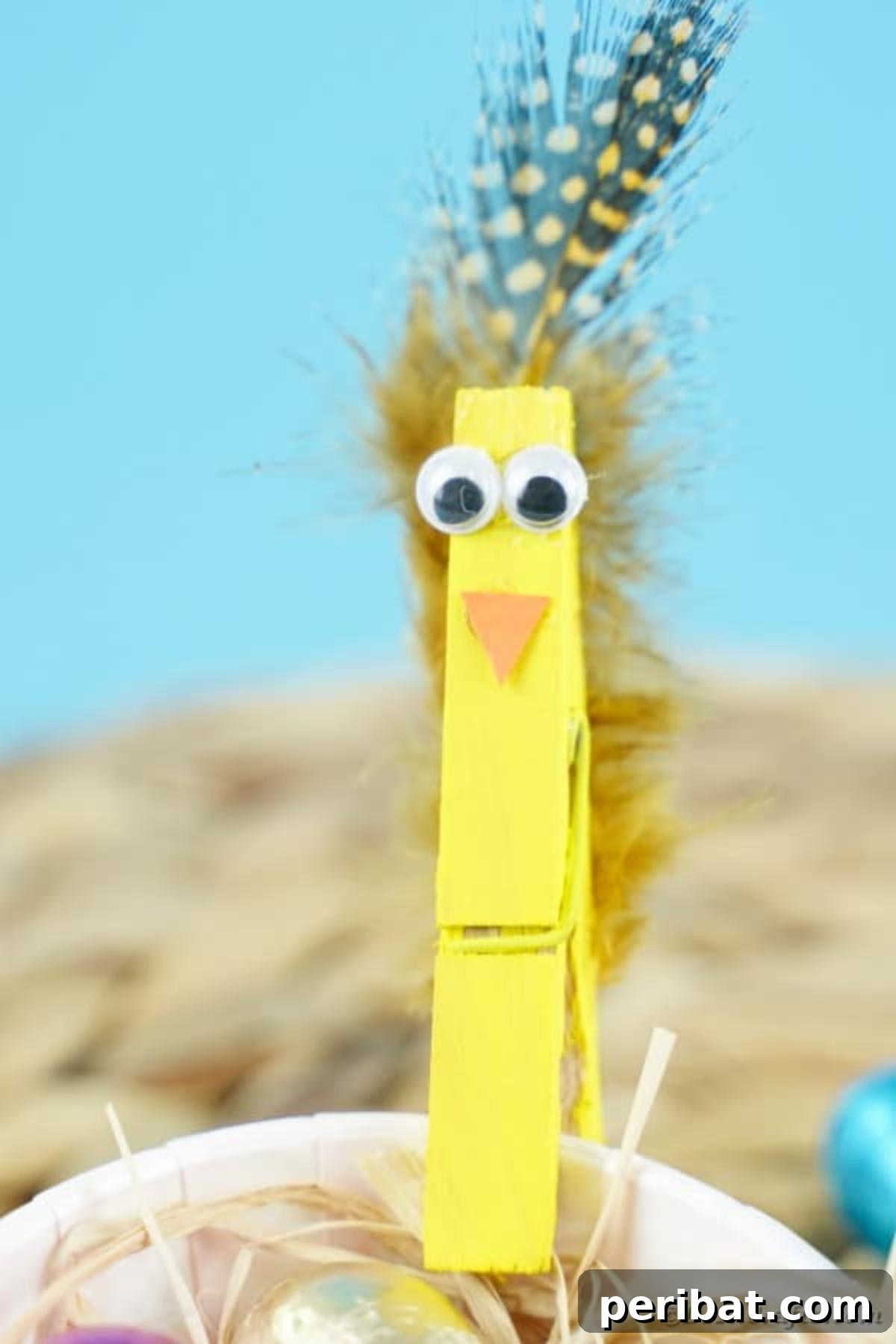 Whimsical Repurposed Clothespin Birds 11 Yellow clothespin bird clipped to cup