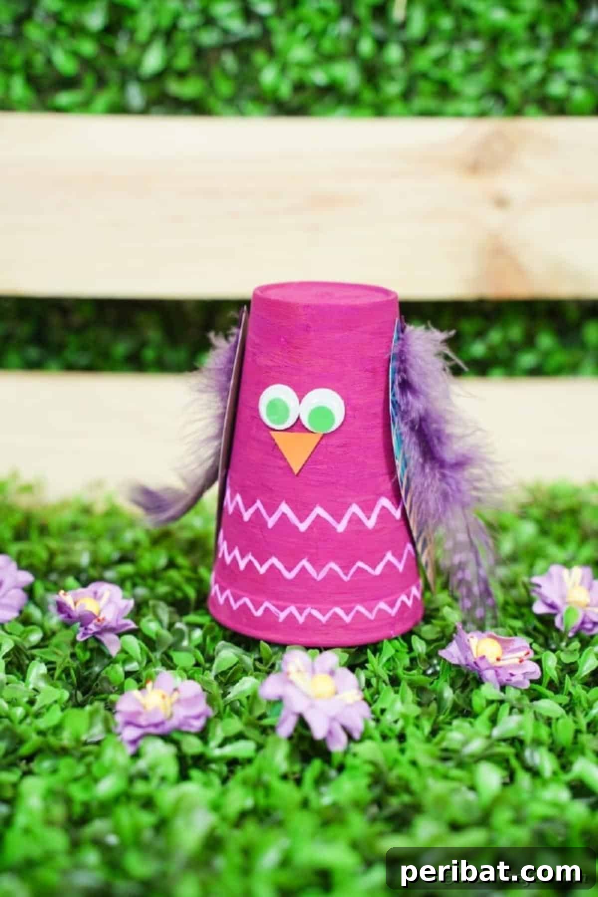 Turn Plastic Cups Into Charming Owls 3 Charming plastic cup owl craft displayed in front of a rustic wooden box.