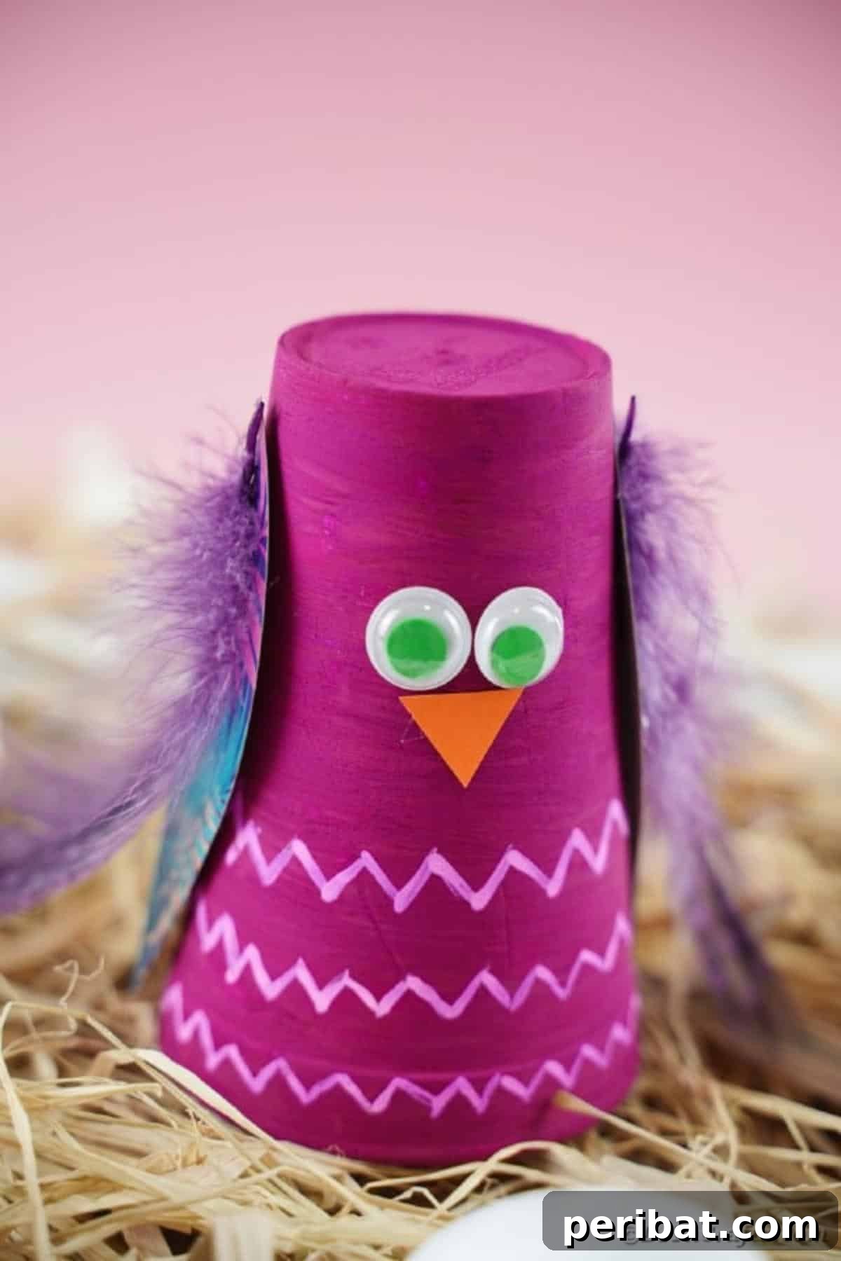 Turn Plastic Cups Into Charming Owls 4 Cute plastic cup owl craft resting on a bed of hay.