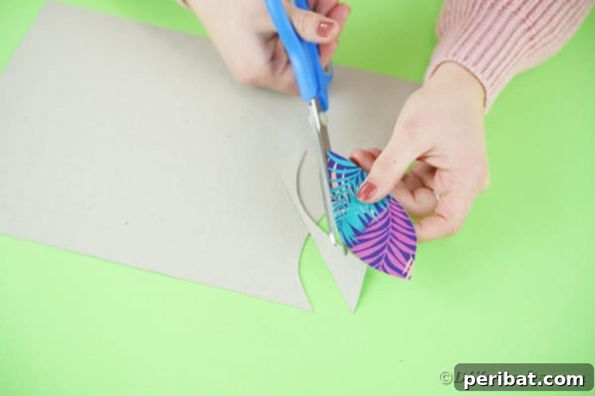 Turn Plastic Cups Into Charming Owls 9 Cutting rounded wing shapes from patterned scrapbook paper.